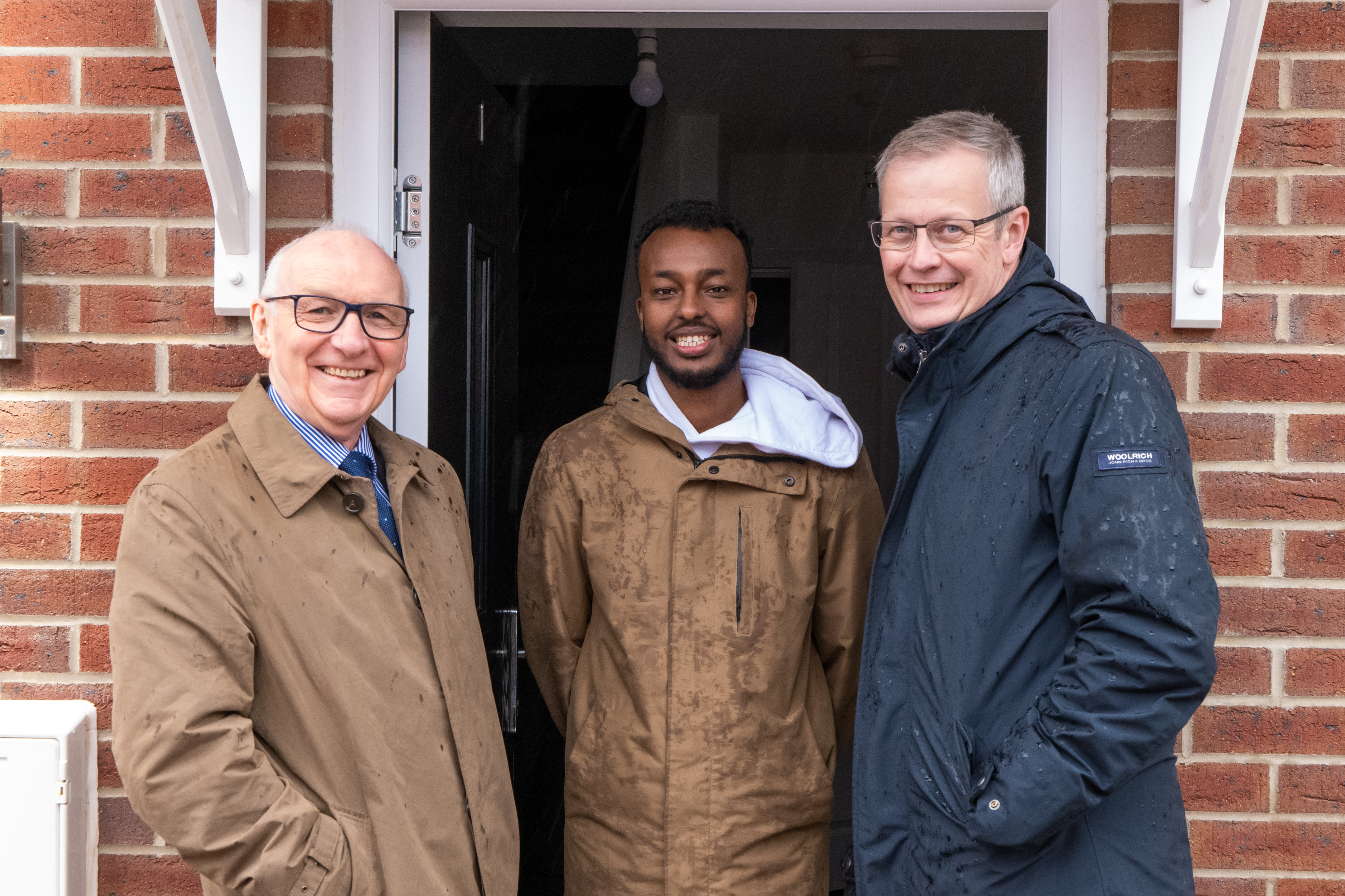Midland Heart's board chair and chief exec with a tenant moving into his new home