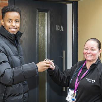 Midland Heart employee handing over keys to a new tenant