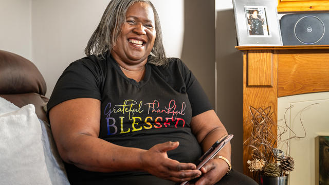A Tenant Laughing In Her Living Room