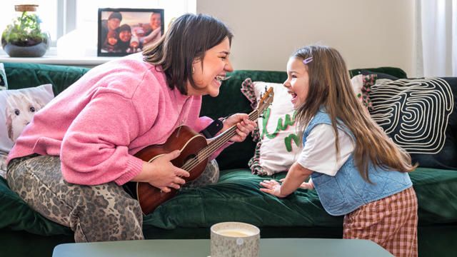 A Tenant Playing Music With Her Daughter