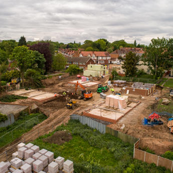 Aerial shot of the construction site with foundations being laid